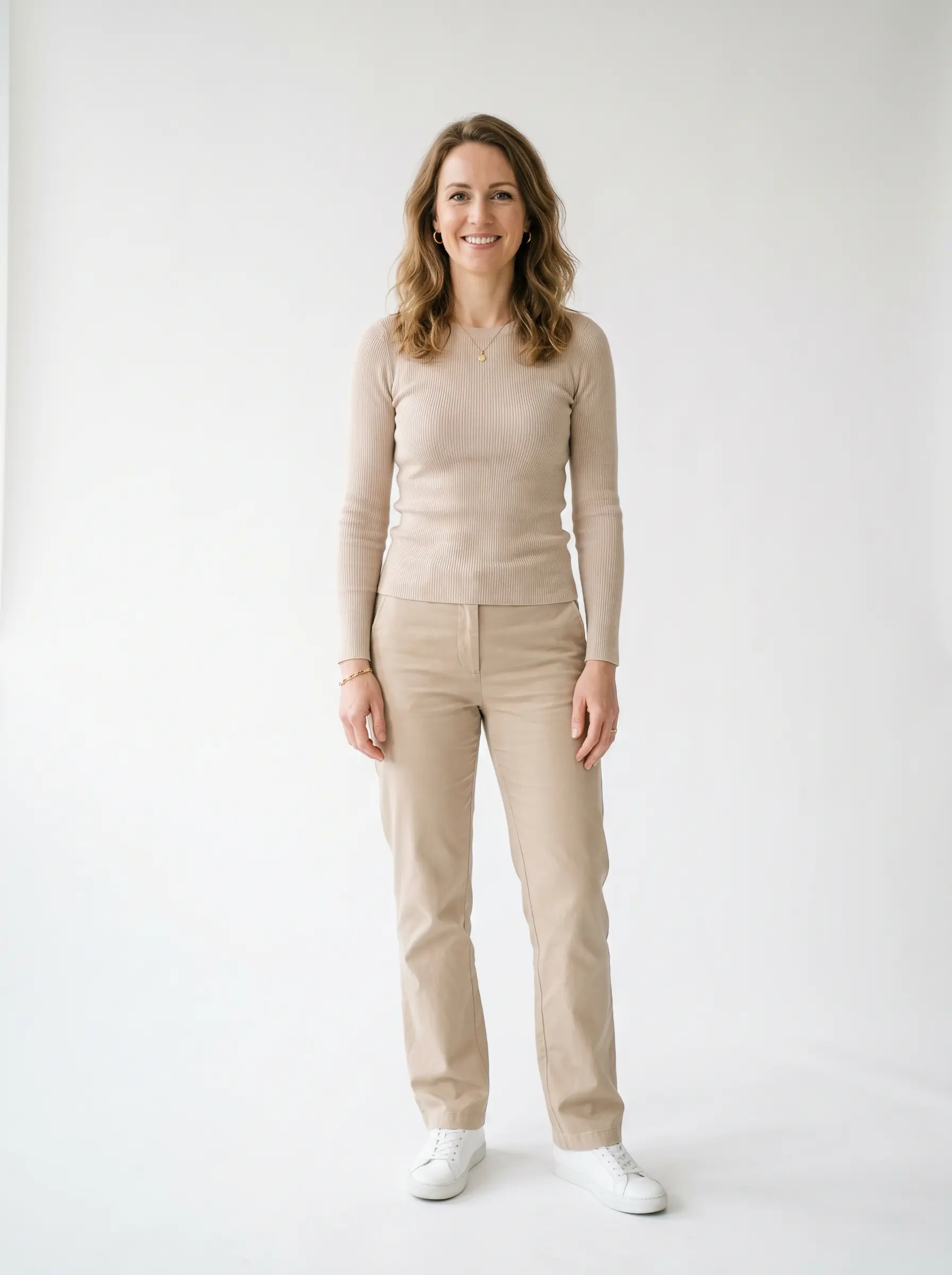 Preset fashion model: woman in a plain beige knit top and trousers on a neutral studio background