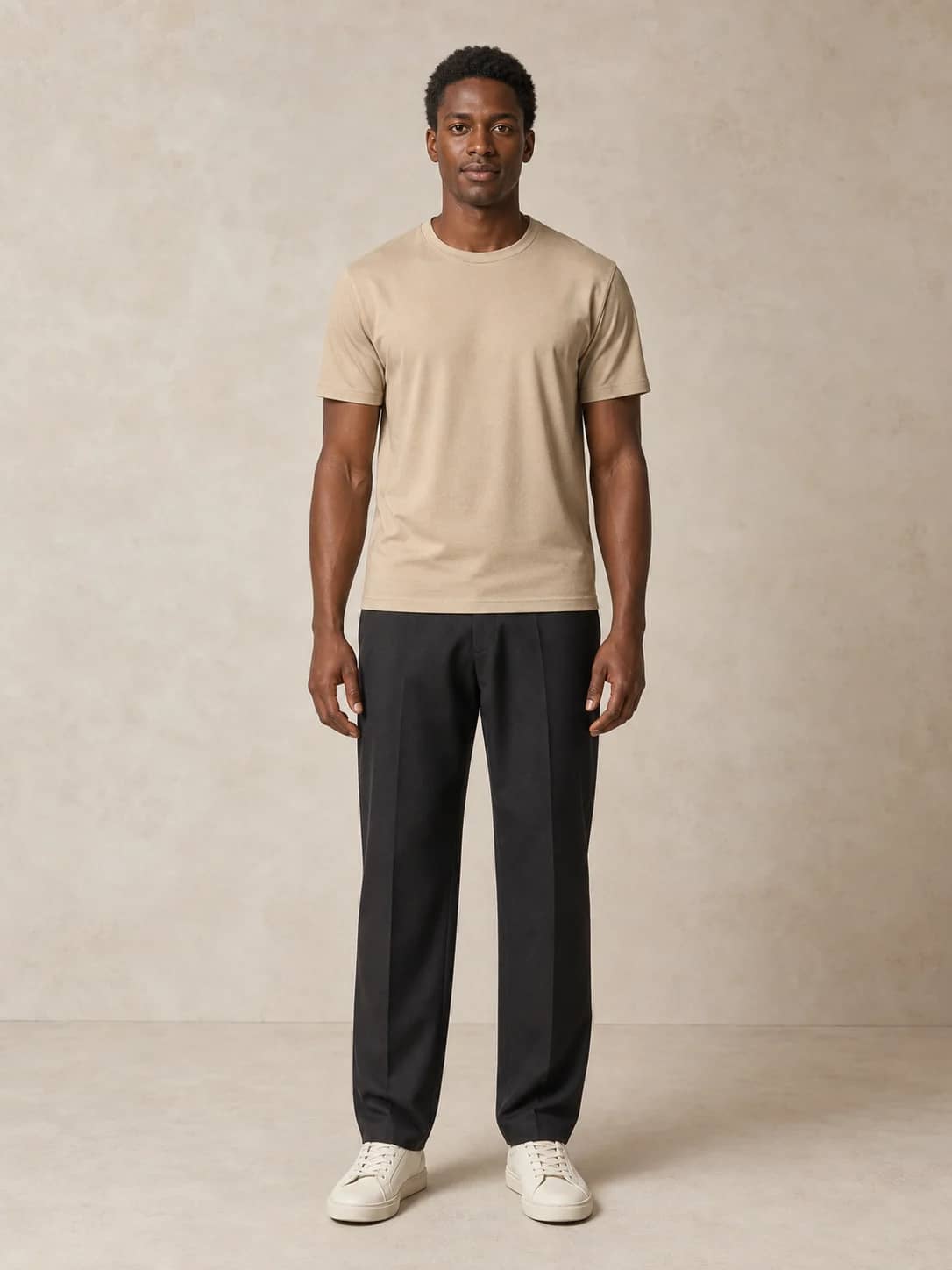 Black man in a sand T-shirt and charcoal trousers used as a virtual try-on person photo